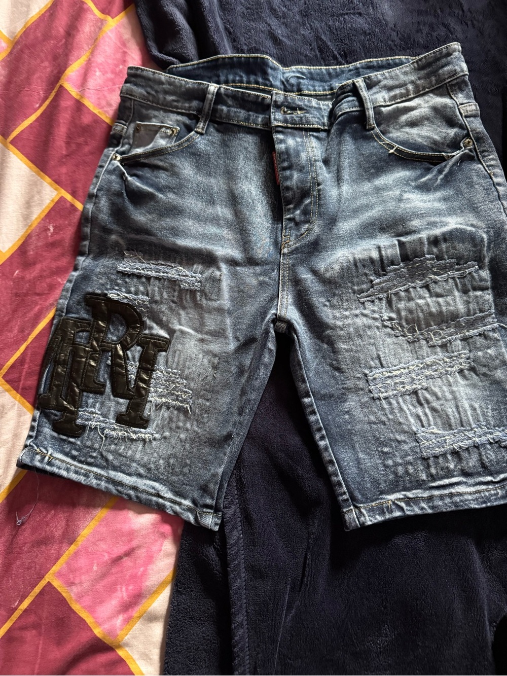 AMIRI Distressed Washed Blue Denim Shorts with Patch